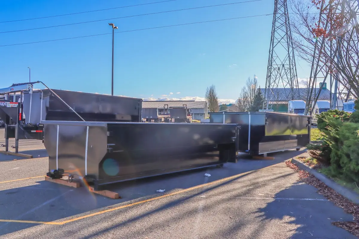 Roll-off dumpster ready for waste disposal at job site for Demolition Dumpster Rental in Monticello